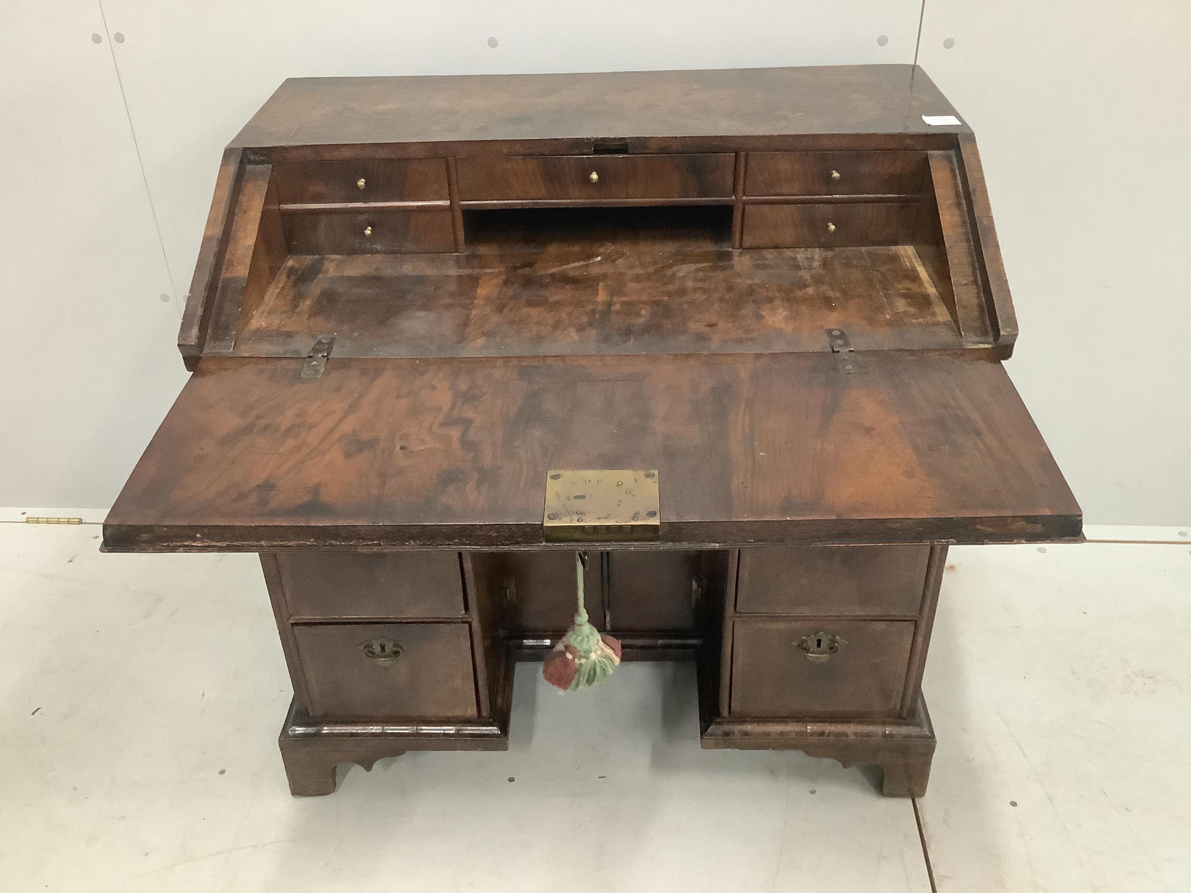 A rare William III walnut and featherbanded kneehole bureau, c.1700, with kneehole underframe, width 91cm, depth 55cm, height 88cm. Purchased from Mallett & Son of New Bond Street, 25th January 1954 for £270. Condition -